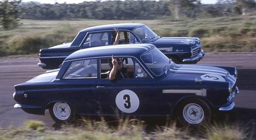 How much did motor racing improve the production car breed in the 1960s and 1970s?